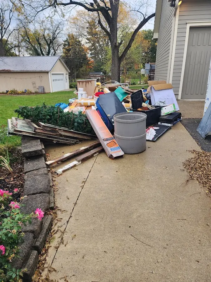 Dumpster being loaded with debris for 10 Yard Dumpster Rental in Marseilles